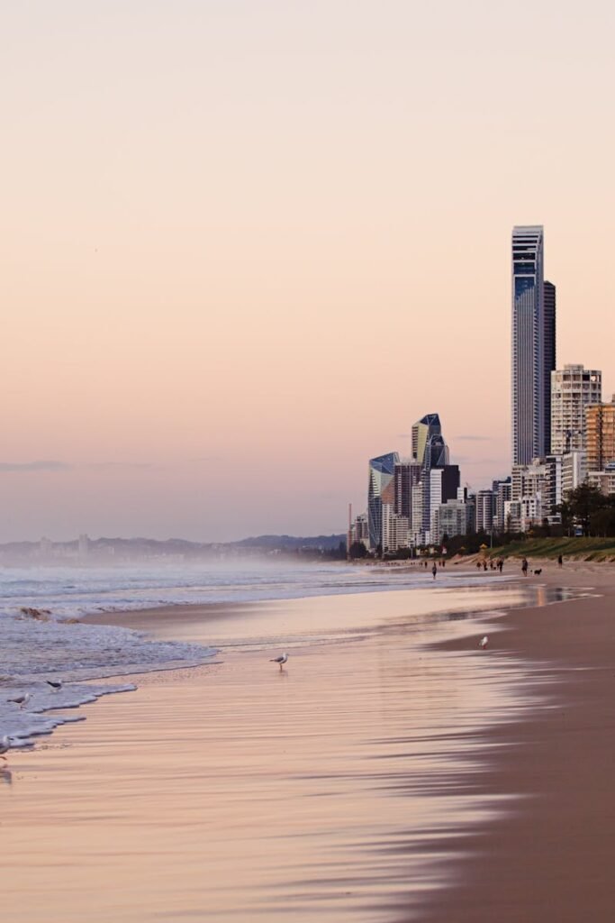 Serene beach view of Surfers Paradise skyline at twilight, Queensland, Australia.