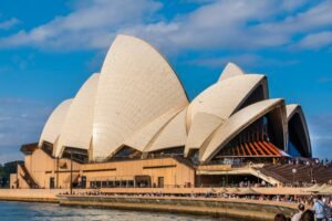 Majestic Sydney Opera House captured against a clear blue sky, showcasing its iconic architecture.