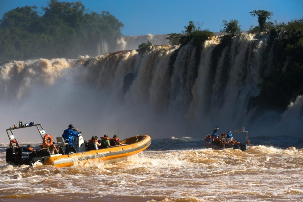 Thrilling boat ride in front of the majestic Iguazu Falls, capturing the adventure and natural beauty.