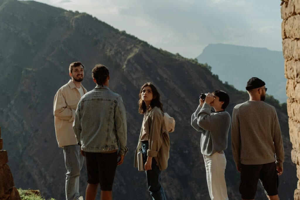 A group of friends explores a scenic mountainous area, enjoying a day of hiking and adventure.